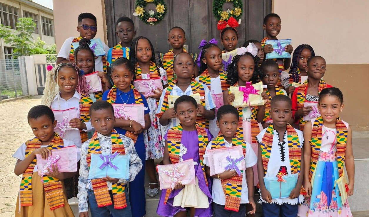 Children and teachers in a school celebration